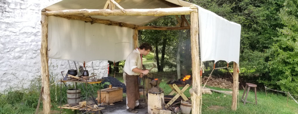 Frontier Culture outdoors masked forge