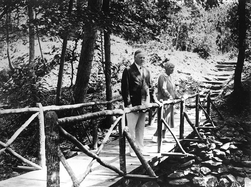 Hoovers on bridge over Mill Prong at Rapidan Camp. Courtesy of National Park Service.